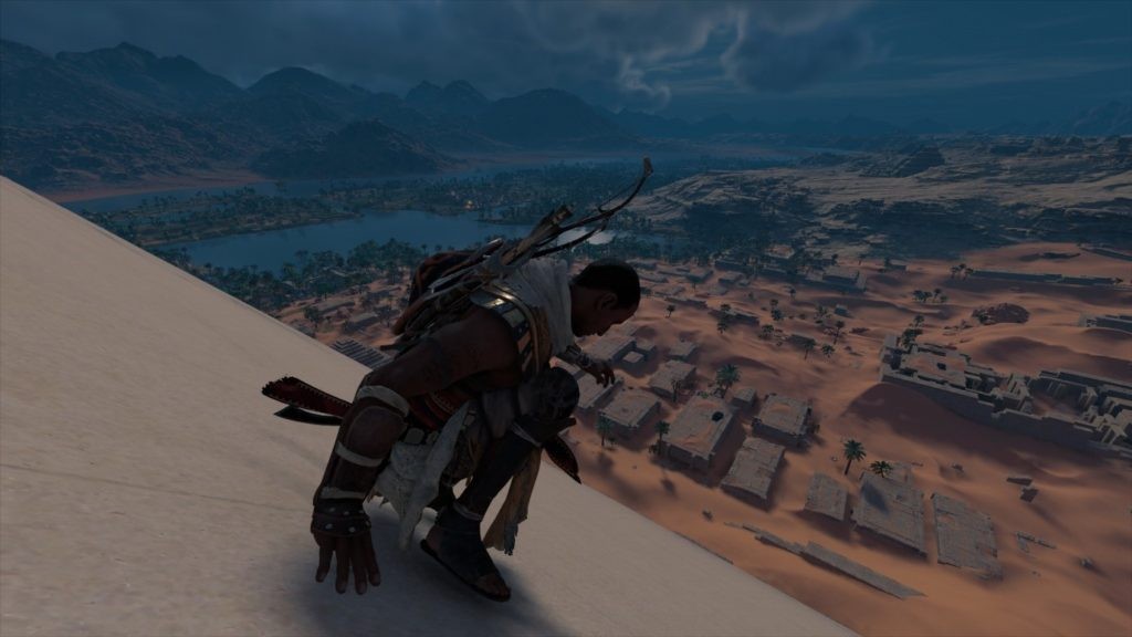 Image Description: Assassin's Creed: Origins - Bayek slides down a pyramid. End of Image Description.